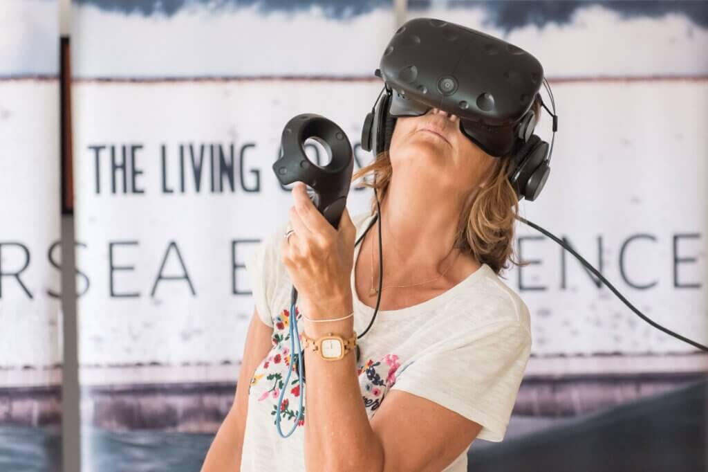 KP Projects. A woman wearing a Virtual Reality headset.